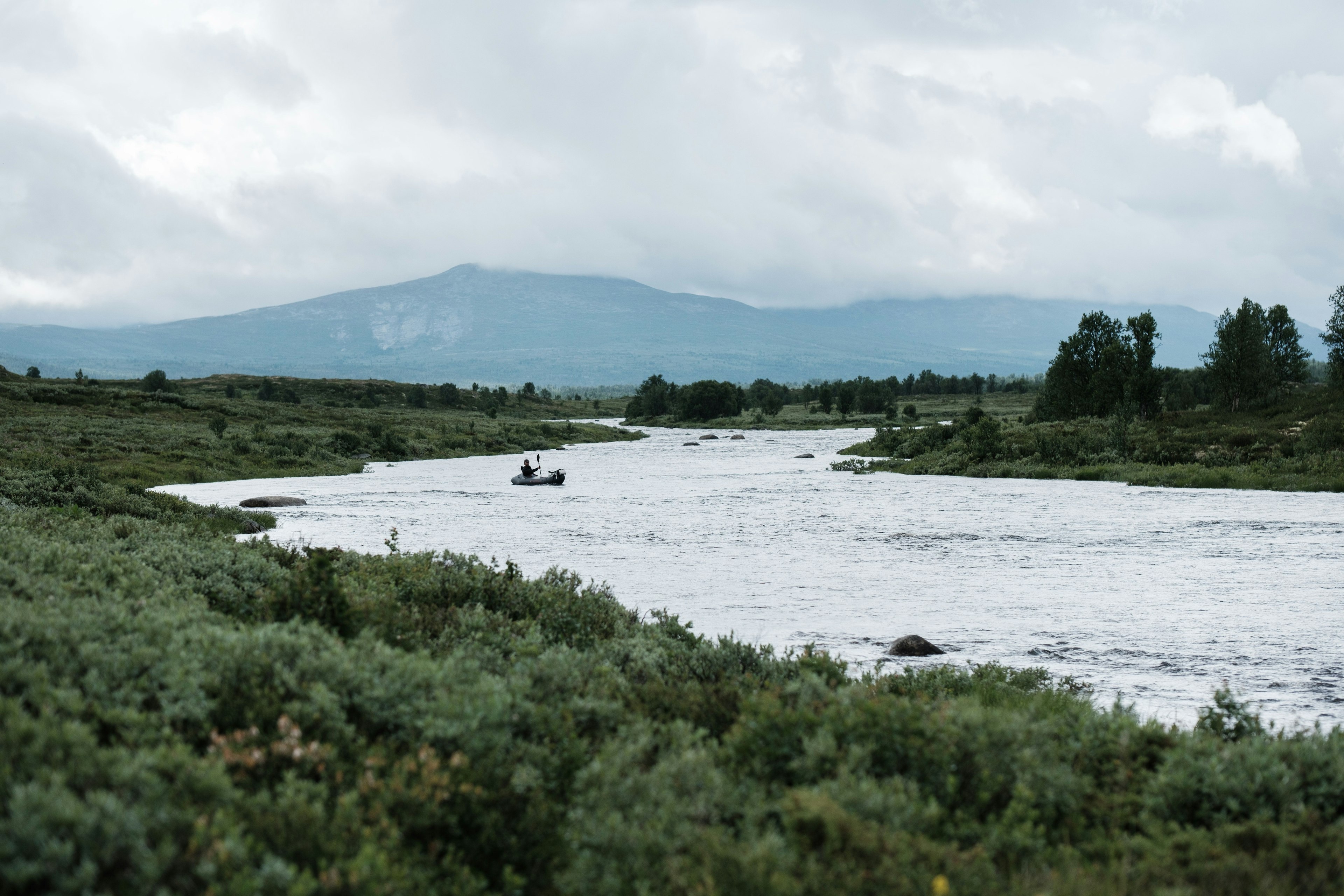 Packraft drifting down a river
