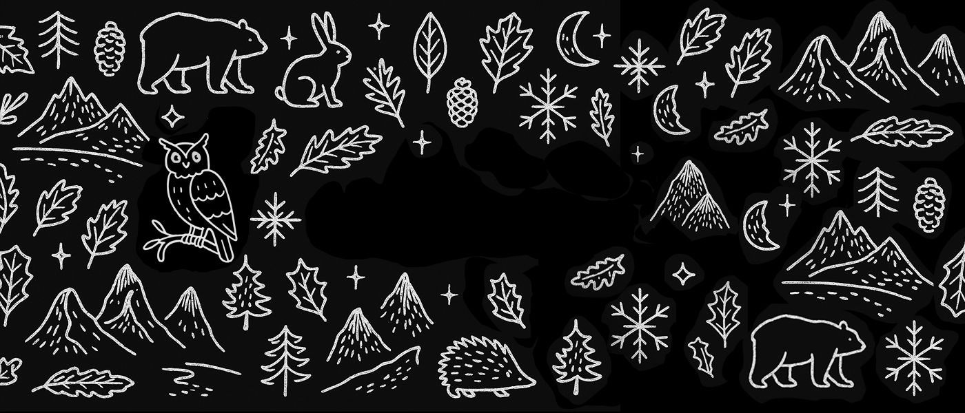 Close-up of knitted Lundhags beanies in earthy tones, surrounded by pine branches and a wrapped gift with an orange ribbon