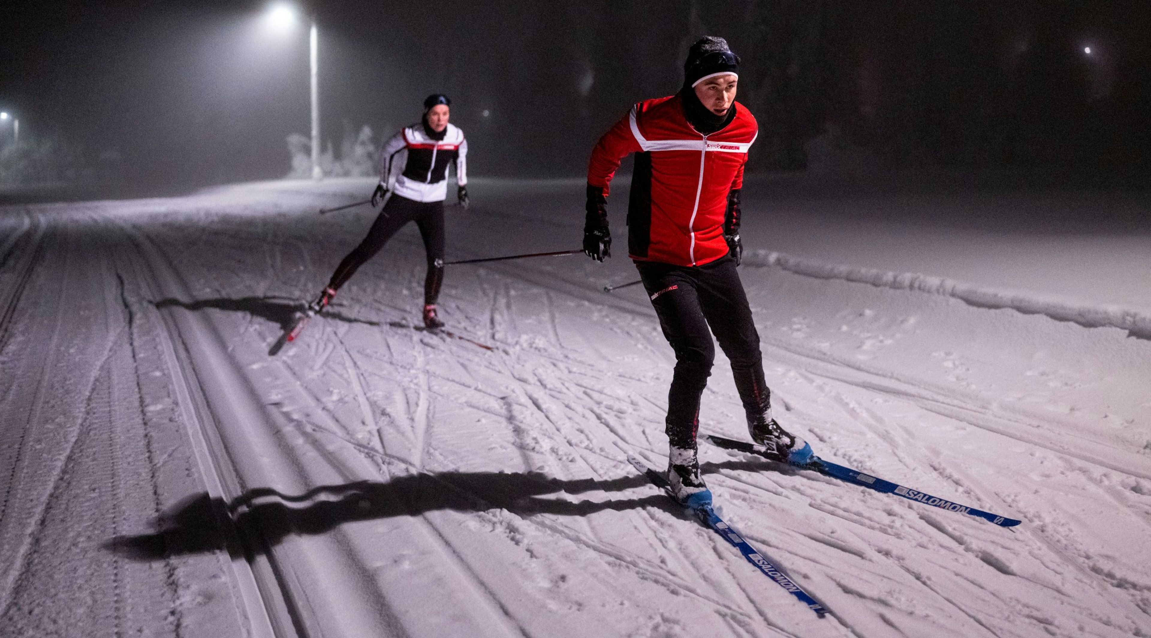Man and women cross country skiing