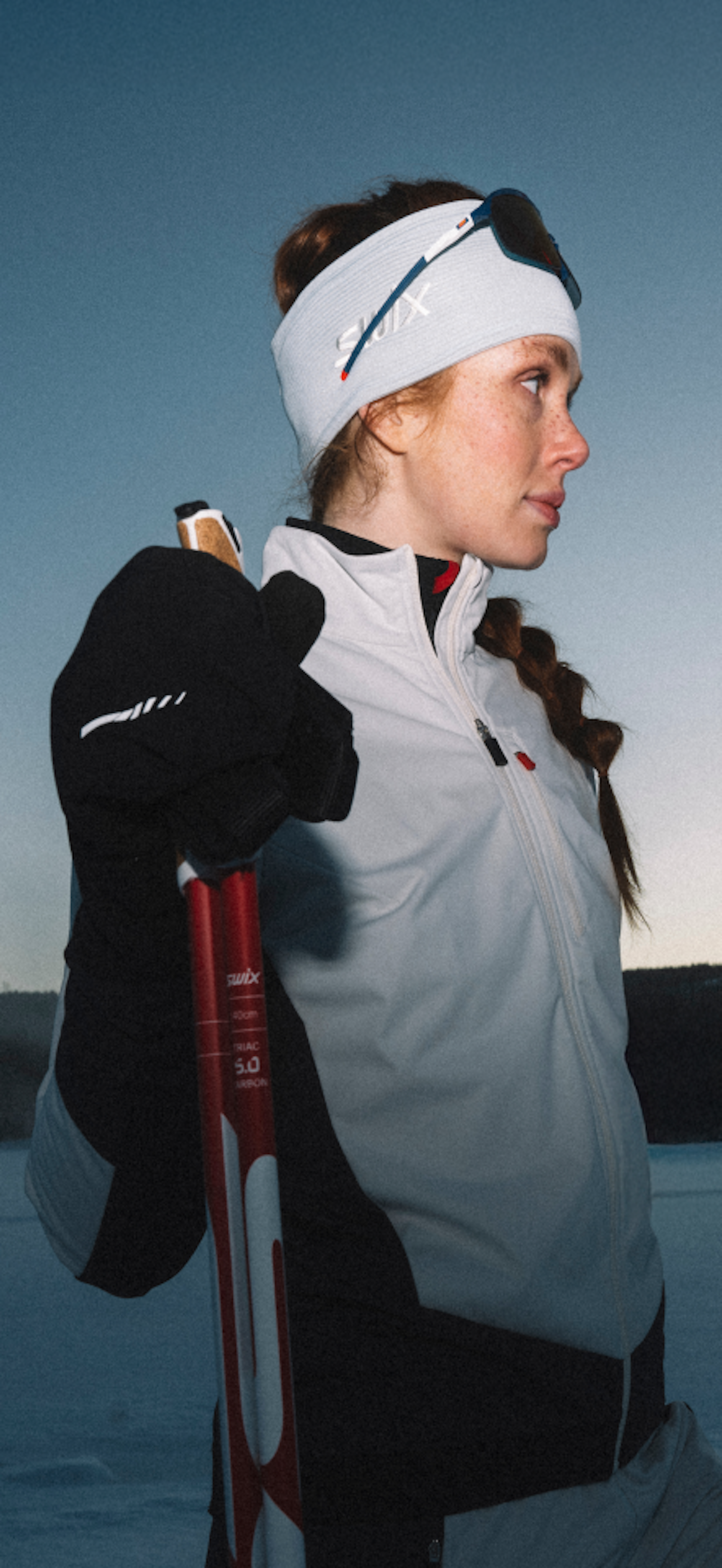 Woman skiing in the forest at twilight (desktop)